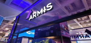 Armis cybersecurity company branding displayed at a technology expo, highlighting operational technology and connected device security solutions.