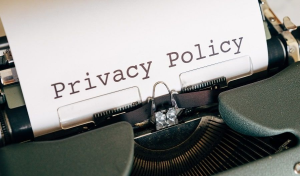 Privacy policy document symbolizing FTC action against GM for unauthorized driver data collection and sharing.