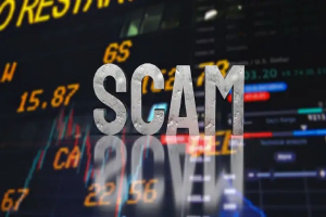 The word scam displayed over financial charts highlighting investment fraud and fake trading platforms.