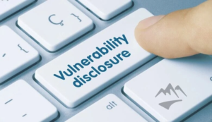 Keyboard key labeled vulnerability disclosure representing the public disclosure of BeyondTrust CVE-2026-1731 critical security flaw.