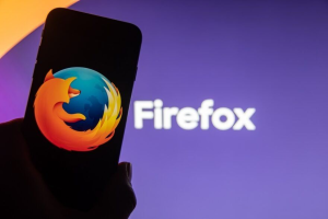 Mozilla Firefox browser logo displayed on a smartphone representing the new update that allows users to disable generative AI features with one click.