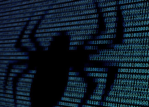 Anonymous cybercriminal silhouette formed with binary code, representing hidden ransomware groups operating online.