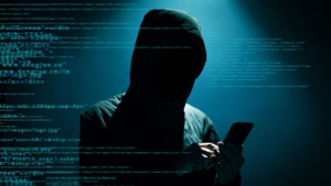 Hooded hacker using smartphone illustrating mobile espionage and cyber attack using DarkSword exploit kit