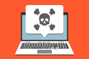 Laptop displaying malware warning symbol representing a malicious browser extension infecting a user's system.