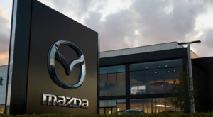 Compromised warehouse management dashboard with inventory boxes and access granted message during Mazda internal system cyberattack