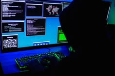 Hacker accessing multiple screens during a cyber espionage attack targeting Mongolian government systems