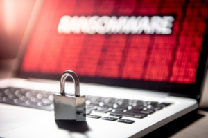 Padlock on laptop with ransomware warning symbolizing data theft and cyber attack on McGraw Hill